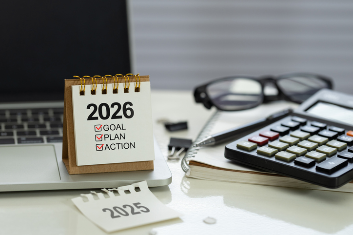 Desk calendar 2026 with checklist Goal, Plan, Action on office workspace