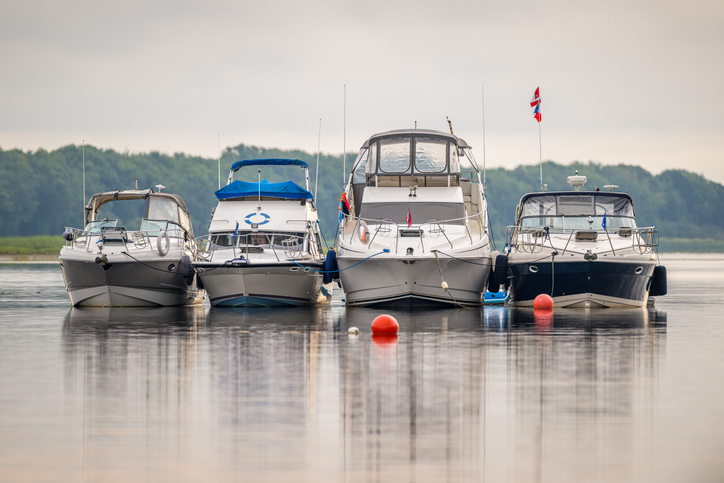 boats tied together on a lake