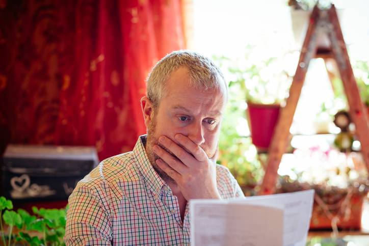 a man reading a business insurance policies document